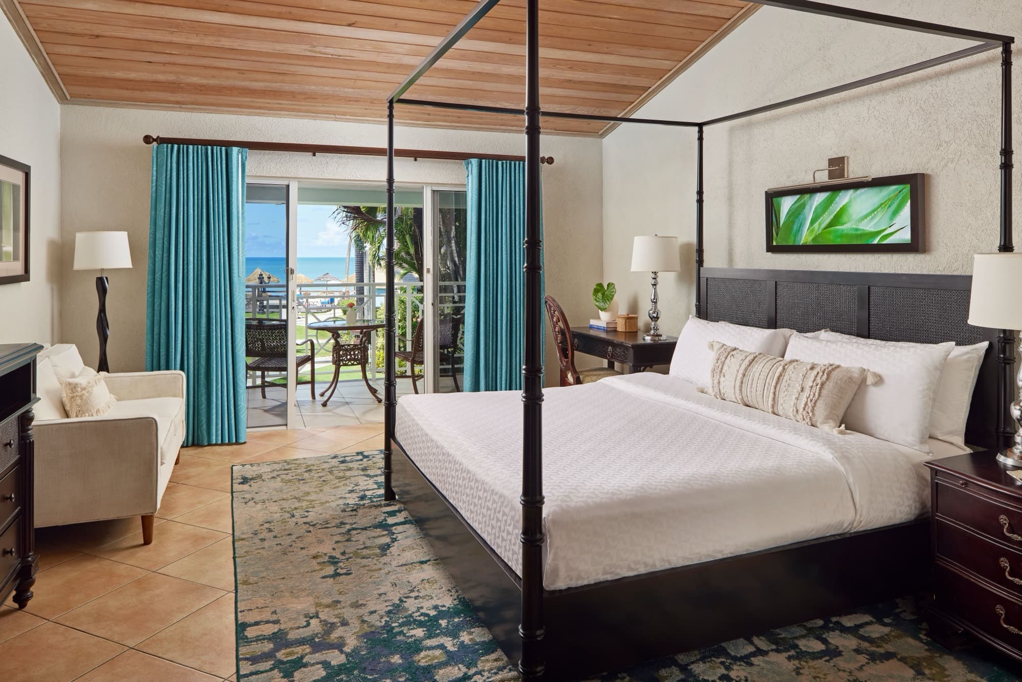 A junior-suite bedroom at Sandals Grande Antigua