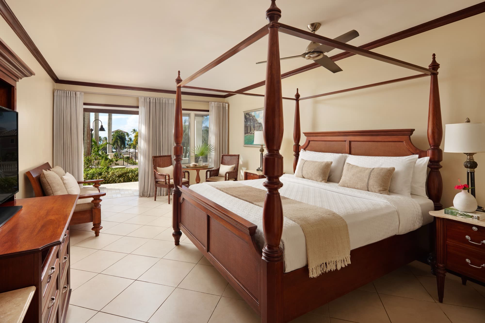 A patio-suite bedroom at Sandals Grande Antigua