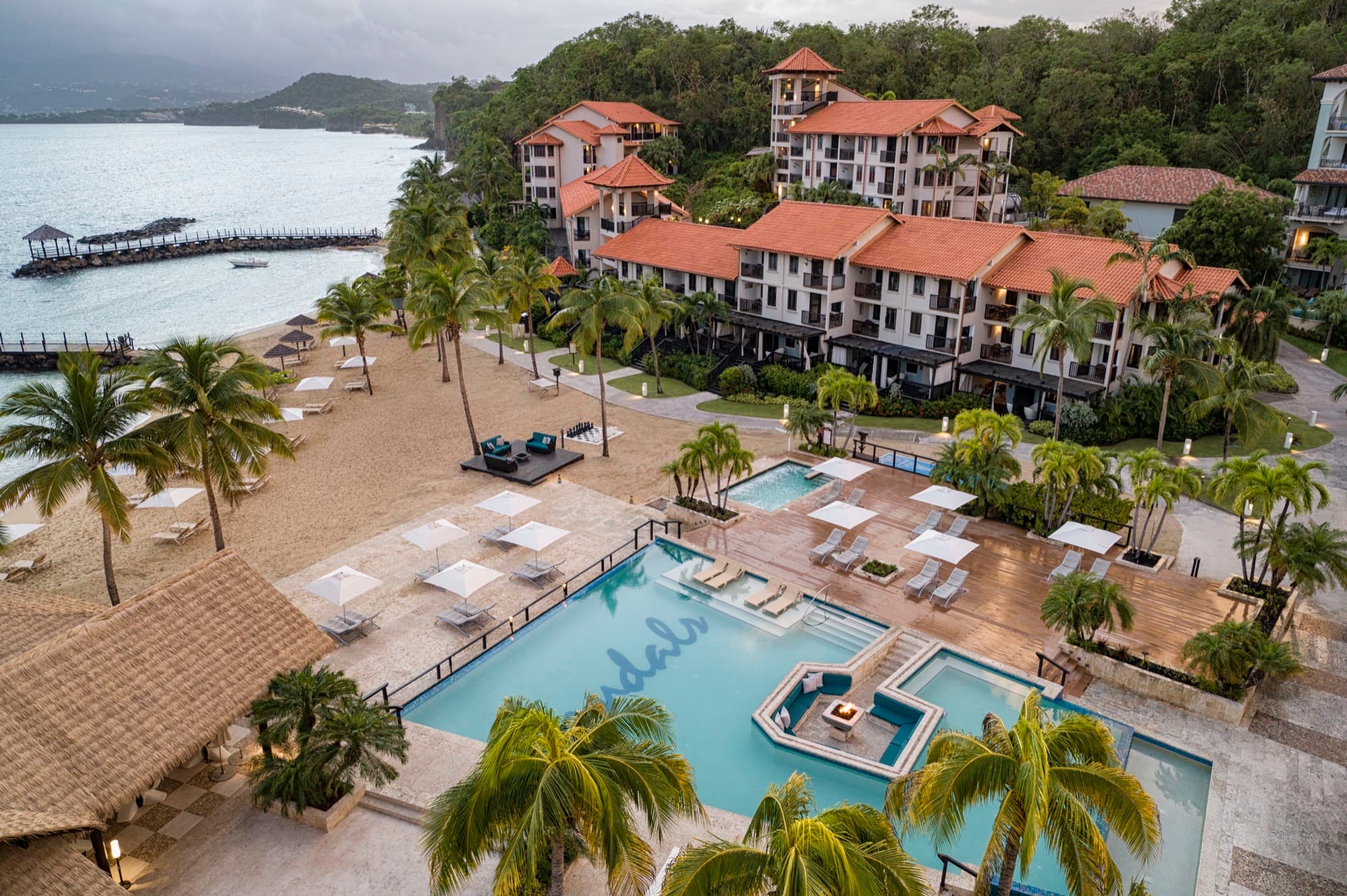 Pink Gin pool and fire pit at Sandals Grenada from above