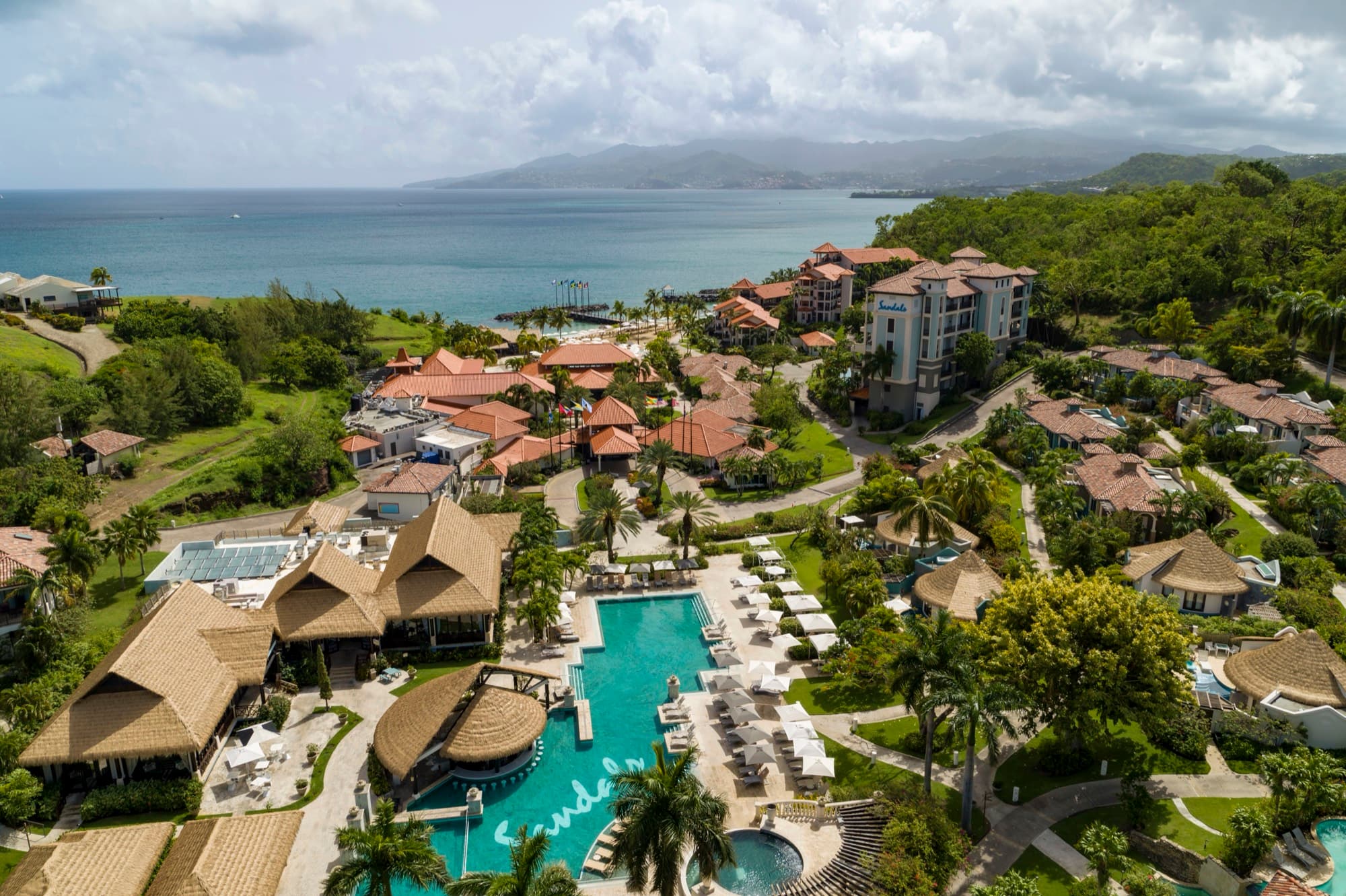 Pool courtyard and ocean at Sandals Grenada from above