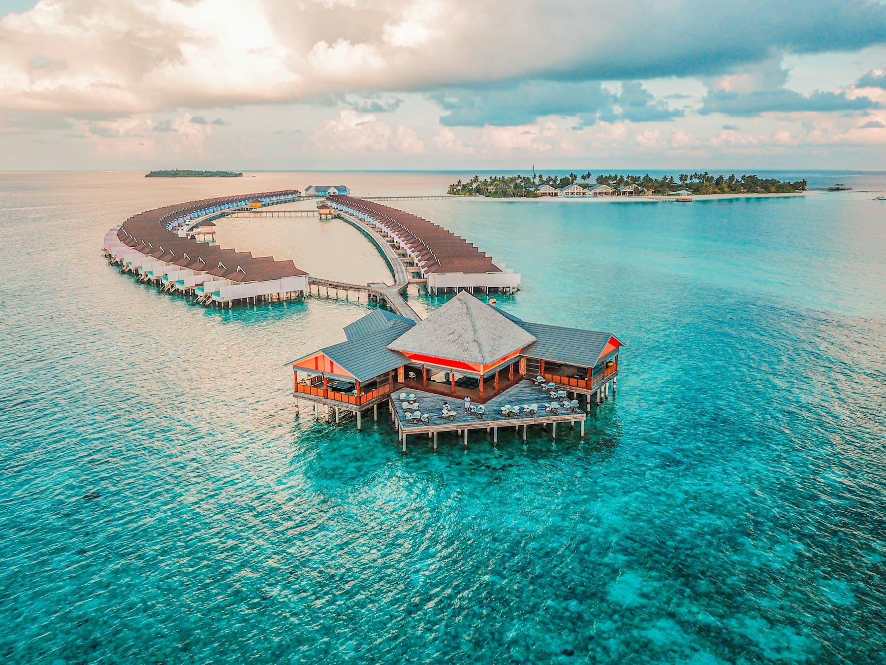 Overwater bungalows on turquoise Caribbean water