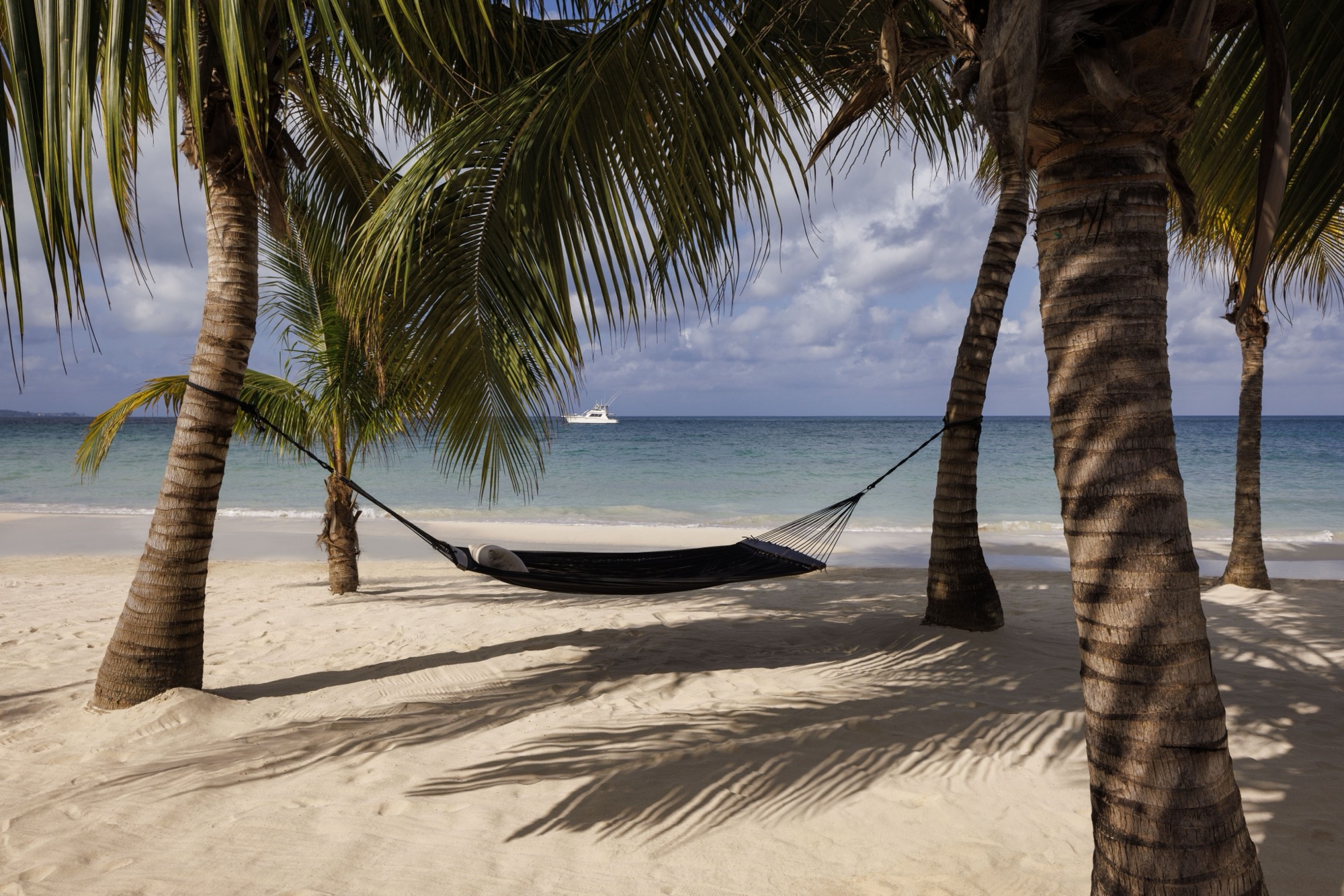 A hammock on the beach at Sandals Negril — start with vibe, then pick the island